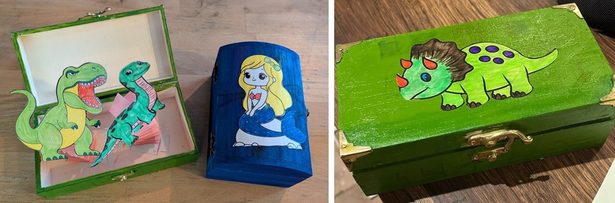 photos of colourful wooden boxes with pop-up paper dinosaurs and mermaids inside.